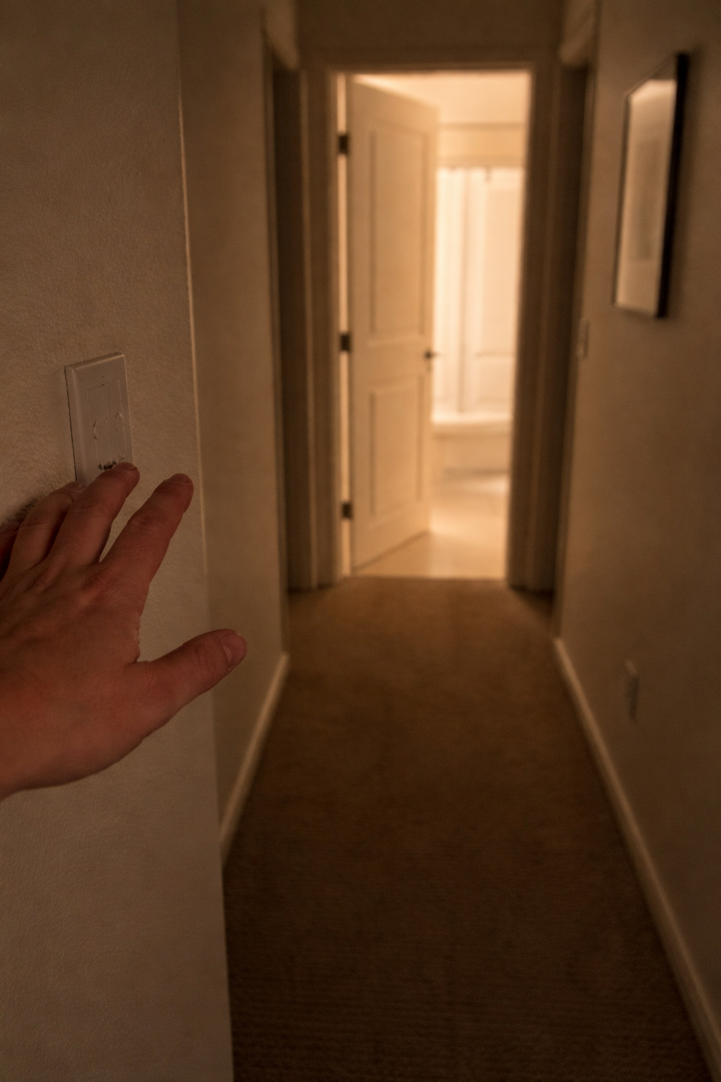 Person standing in a rental property looking thoughtful